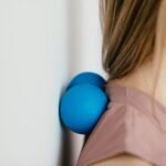 Close-up of a woman using massage balls for muscle relief