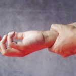 Close-up of hands, symbolizing tingling or pins and needles sensation
