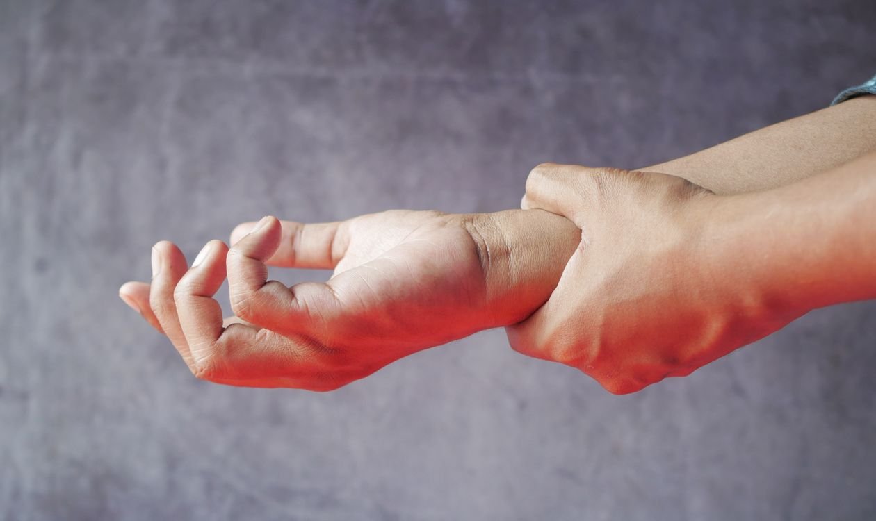 Close-up of hands, symbolizing tingling or pins and needles sensation