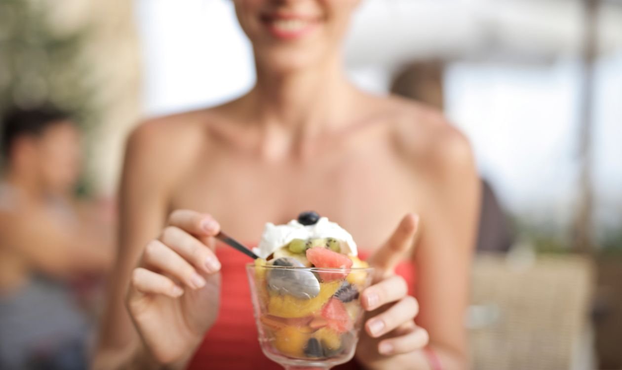 Woman about to eat ice cream, illustrating cold sensitivity in teeth