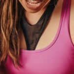 Woman holding her knee in pain during outdoor activity
